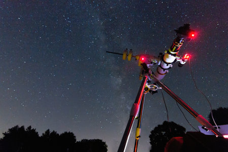 Astrophotography setup in clear night. Refractor type telescope. Telescope in real starry night....