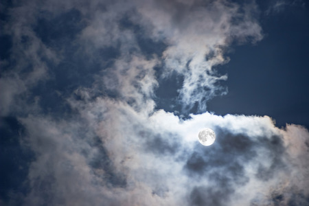 Night sky with Full Moon and clouds. Mysterious night sky with full moon.の写真素材