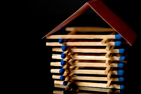 Fire insurance. Wooden house insurance. Safe house.の写真素材