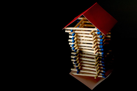 Fire insurance. Wooden house insurance. Safe house.の写真素材