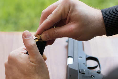 Loading a magazine. Loading Gun. Handgun magazine,