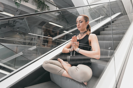 Young woman doing yoga. Urban Yoga. Yoga meditation.の写真素材