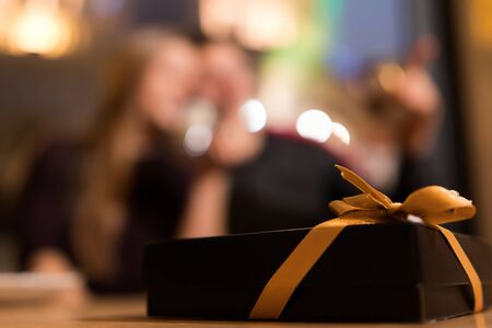 Romantic date. Loving couple sitting in the cafe. Blurred couple.の写真素材