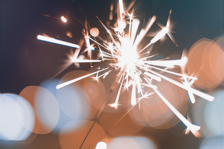 Night background with a sparkler. Sparkler  Bokeh 
Colorful sparkler. Shallow focusの写真素材