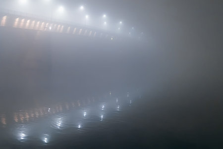 Bridge in the fog. Night Bridge Thick Fog. Night shot of a bridge in thick fog.の写真素材