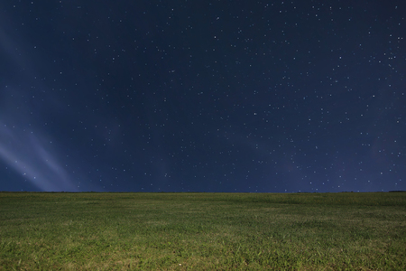 Night meadow background. Night starry sky. Night sky with starsの写真素材