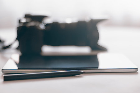 Photographer Workspace on white table, tablet and camera copy space.の写真素材