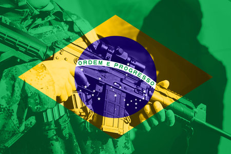 Soldier with machine gun with national flag of Brasilの写真素材