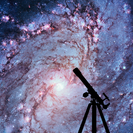 Space background with silhouette of telescope. Messier 83, Southern Pinwheel Galaxy, M83 in the constellation Hydra.の写真素材