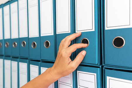 A businesswoman filing all the business documentations neatlyの写真素材