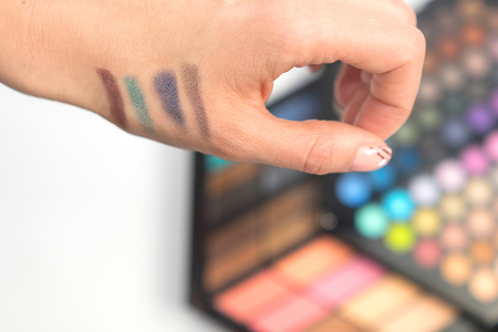 Eye shadow swatches on woman hand. Decorative cosmetics.の写真素材