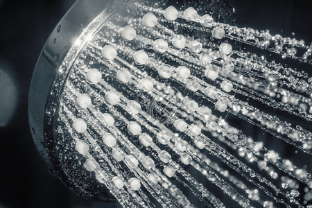 Shower head with flow of water closeupの写真素材