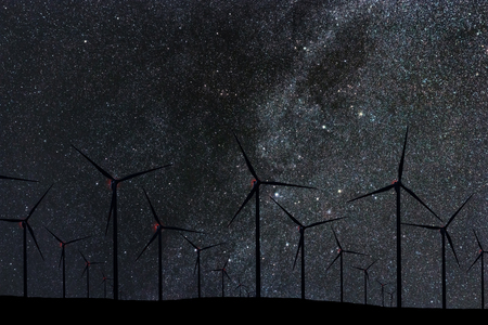 Night Sky Over Wind Farm. Energy and nature Night Sky.の写真素材