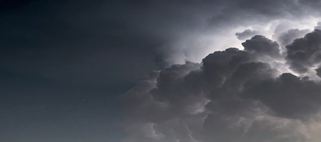 Dramatic Storm Clouds background. Lightning in the clouds. Night Clouds.の写真素材