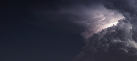 Dramatic Storm Clouds background. Lightning in the clouds. Night Clouds.の写真素材