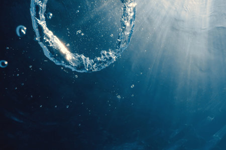 Bubble ring Underwater ascends towards the sun.