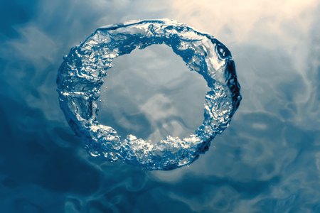 Bubble ring Underwater ascends towards the sun.の写真素材