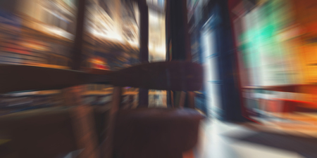 Blurred cafe restaurant background night time, modern Coffee shop blur background with colorful bokehの写真素材