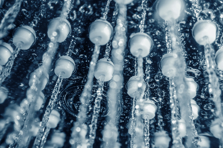 Shower head with running water closeupの写真素材