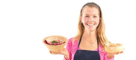 Young woman holding raw vegan healthy food. Raw food concept  bamboo bowlの写真素材