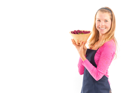 Young woman holding raw vegan healthy food. Raw food concept  bamboo bowlの写真素材