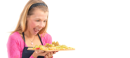 Happy Young woman holding Healthy raw vegan breakfast fresh fruit.の写真素材