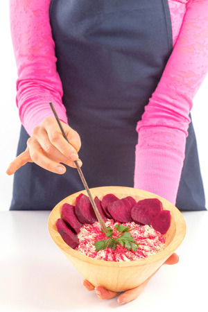 Female holding raw vegan healthy food. Raw food concept  bamboo bowlの写真素材