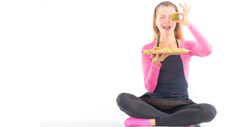 Happy Young woman holding Healthy raw vegan breakfast fresh fruit.の写真素材
