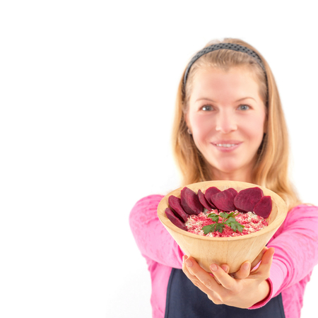 Young woman holding raw vegan healthy food. Raw food concept  bamboo bowlの写真素材