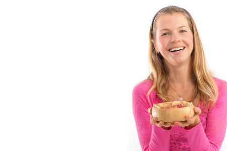 Young woman holding raw vegan healthy food. Raw food concept  bamboo bowlの写真素材