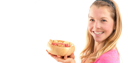 Young woman holding raw vegan healthy food. Raw food concept  bamboo bowlの写真素材