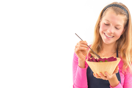 Young woman holding raw vegan healthy food. Raw food concept  bamboo bowlの写真素材