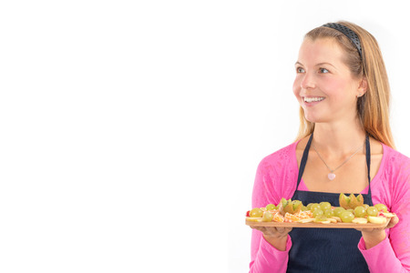 Happy Young woman holding Healthy raw vegan breakfast fresh fruit.の写真素材