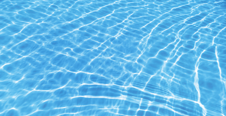 Blue ripped water in swimming pool backgroundの写真素材