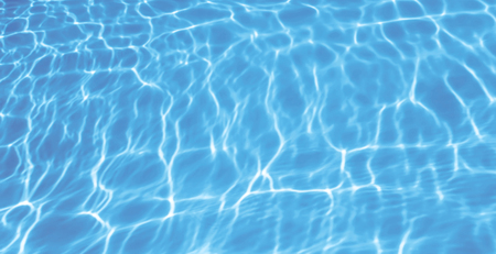 Blue ripped water in swimming pool backgroundの写真素材