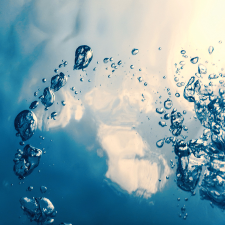 Underwater bubbles with sunlight. Underwater background bubbles.の写真素材