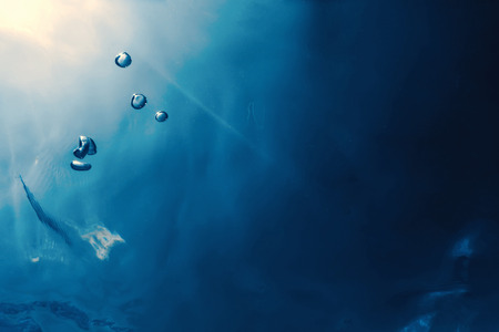 Underwater bubbles with sunlight. Underwater background bubbles.の写真素材