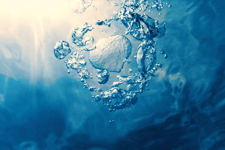 Underwater bubbles with sunlight. Underwater background bubbles.の写真素材