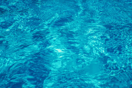Swimming pool water sun reflection background. Ripple Water.の写真素材
