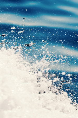Ocean wave surface, crashing wave with foam on its topの写真素材
