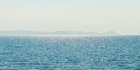 Sea and mountain range. Summer seascape horizon.の写真素材