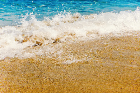 Wave of blue ocean on sandy beach Summer Backgroundの写真素材