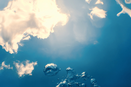 Underwater bubbles with sunlight. Underwater background bubbles.の写真素材