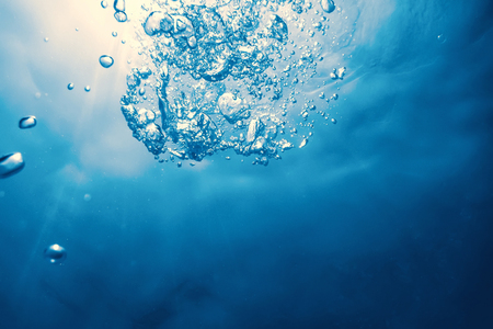 Underwater bubbles with sunlight. Underwater background bubbles.の写真素材