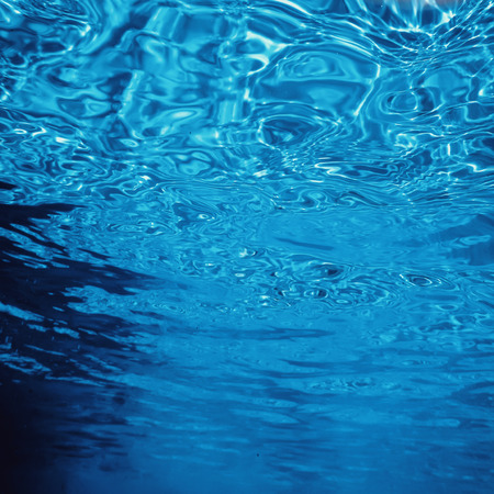 Water surface underwater, Swimming pool surface Water backgroundの写真素材