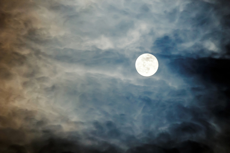 Full Moon with clouds at Night, Dramatic clouds in the moonlightの写真素材
