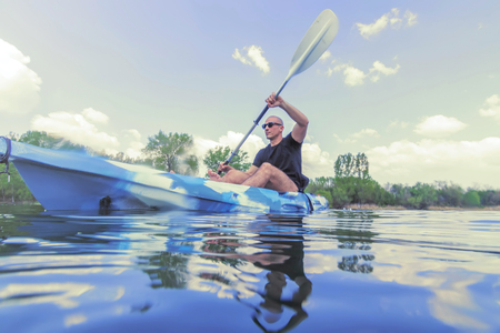 Young Man Kayaking on Lake. Lake Kayaking.の写真素材