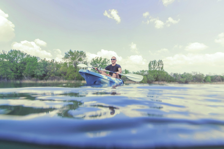Young Man Kayaking on Lake. Lake Kayaking.の写真素材