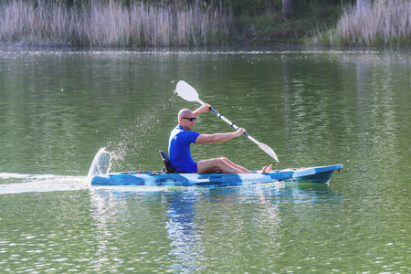 Young Man Kayaking on Lake. Lake Kayaking.の写真素材