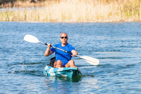 Young Man Kayaking on Lake. Lake Kayaking.の写真素材
